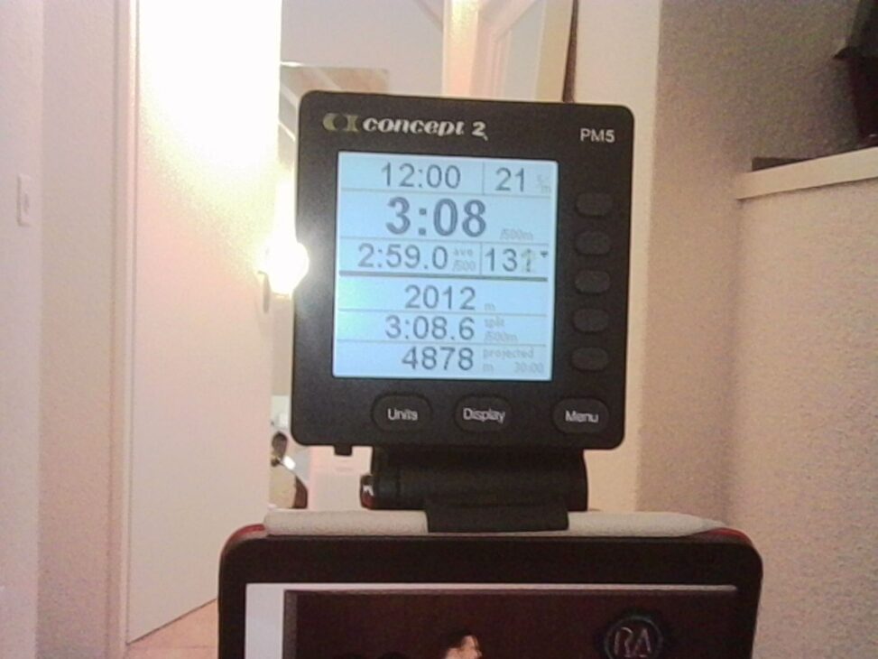 Concept2 rowing machine display showing workout time, pace, and distance during a rehabilitation rowing session.