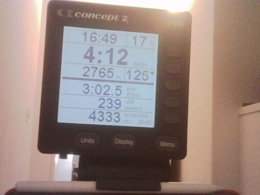 Concept2 rowing machine monitor showing workout stats, including distance around 2765 meters and split pace.