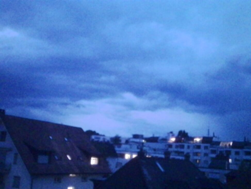 Ominous evening clouds over rooftops in Zurich